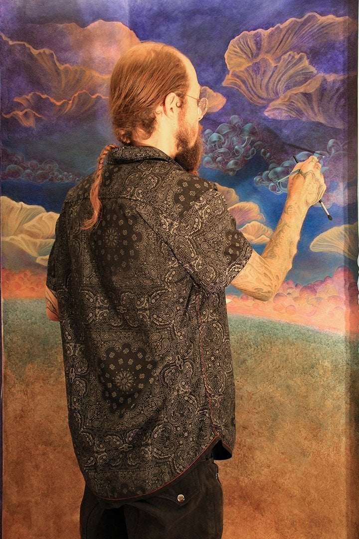 David Heskin painting Mushroom Cafe mural